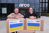 Andy Owen, head of healthcare and Anna Harvatt, community engagement manager, with boxes of PPE for Ukraine.